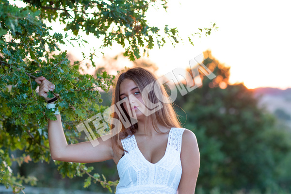 Young Girl posing near the magic tree